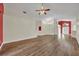 Spacious living room features wood floors and an open concept design to the kitchen at 314 Lady Diana Dr, Davenport, FL 33837