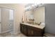 Bathroom with a double sink vanity, large mirror, and ample counter space at 3333 Messina Dr, Lake Mary, FL 32746