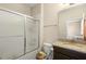 Well-maintained bathroom with granite counters, a shower, and a modern sliding glass door at 3333 Messina Dr, Lake Mary, FL 32746