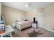 Comfortable bedroom featuring soft lighting, a stylish area rug, and neutral decor at 3333 Messina Dr, Lake Mary, FL 32746