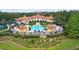A high angle view of a clubhouse with a pool and ample lounge seating at 3333 Messina Dr, Lake Mary, FL 32746