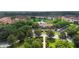 A scenic aerial view showcases the clubhouse, pond, and lush landscaping at 3333 Messina Dr, Lake Mary, FL 32746