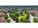 Aerial view showcasing community landscaping, trees, buildings, and green spaces at 3333 Messina Dr, Lake Mary, FL 32746