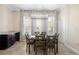 Bright dining room features tile floors, elegant light fixture, and a stylish table with chairs at 3333 Messina Dr, Lake Mary, FL 32746