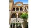 Charming three-story townhouse with arched entry, private balconies, and well-manicured landscaping at 3333 Messina Dr, Lake Mary, FL 32746