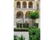 Charming three-story townhouse featuring arched entry, private balconies, and landscaped front yard at 3333 Messina Dr, Lake Mary, FL 32746