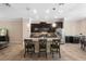 A modern kitchen with a granite island, pendant lighting, and stainless steel appliances at 3333 Messina Dr, Lake Mary, FL 32746