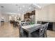 Modern open-concept kitchen with dark cabinets, stainless steel appliances, and a spacious island at 3333 Messina Dr, Lake Mary, FL 32746