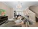 An expansive living room and kitchen and comfortable sectional sofa with decorative pillows at 3333 Messina Dr, Lake Mary, FL 32746