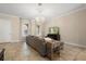 Cozy living room with tile floors, stylish sofa, elegant chandelier, and abundant natural light at 3333 Messina Dr, Lake Mary, FL 32746