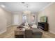 Inviting living room with a chandelier, neutral tones, and comfortable seating at 3333 Messina Dr, Lake Mary, FL 32746