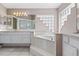 Bathroom equipped with a soaking tub, double sinks, and glass door shower at 346 Hickory Springs Ct, Debary, FL 32713
