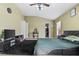 Bedroom boasting a ceiling fan, walk-in closet, and dark shag rug at 346 Hickory Springs Ct, Debary, FL 32713