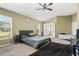 Spacious bedroom with plush carpet, ceiling fan, and ensuite bathroom access at 346 Hickory Springs Ct, Debary, FL 32713