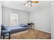 Bedroom featuring neutral walls, ceiling fan, and large window for natural light at 346 Hickory Springs Ct, Debary, FL 32713