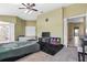 Bedroom featuring a ceiling fan, twin bed, and view of the ensuite bathroom at 346 Hickory Springs Ct, Debary, FL 32713