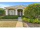 Charming single-story home with a well-manicured lawn and inviting front entrance at 346 Hickory Springs Ct, Debary, FL 32713
