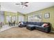 Open living area with view of dining area and large sectional, offering a comfortable and inviting space at 346 Hickory Springs Ct, Debary, FL 32713