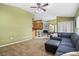 Spacious living area featuring a breakfast bar and an open layout, perfect for entertaining and gatherings at 346 Hickory Springs Ct, Debary, FL 32713