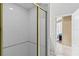 Bathroom featuring a tiled shower with a glass door and a view into another room at 346 Hickory Springs Ct, Debary, FL 32713