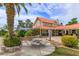 Backyard with dining area, picnic table, lush landscaping, and a view of the main house at 36408 E Eldorado Lake Dr, Eustis, FL 32736