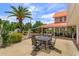 A beautifully landscaped backyard with a large patio and lush garden areas offering a serene outdoor living space at 36408 E Eldorado Lake Dr, Eustis, FL 32736