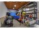 Unfinished basement offering ample storage space with shelves and lighting at 36408 E Eldorado Lake Dr, Eustis, FL 32736