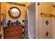 Bathroom featuring vanity with a round mirror and a shower with a curtain at 36408 E Eldorado Lake Dr, Eustis, FL 32736