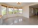 Bright breakfast nook with multiple windows and tiled floors at 36408 E Eldorado Lake Dr, Eustis, FL 32736