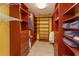 Custom walk-in closet with built-in shelving and drawers for optimal storage solutions at 36408 E Eldorado Lake Dr, Eustis, FL 32736