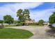Traditional two-story home with mature trees, lush lawn and a detached garage with car port at 36408 E Eldorado Lake Dr, Eustis, FL 32736