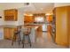 Beautiful kitchen featuring custom cabinets and an island with barstool seating at 36408 E Eldorado Lake Dr, Eustis, FL 32736