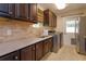 Convenient laundry room includes modern appliances and ample counter space at 36408 E Eldorado Lake Dr, Eustis, FL 32736