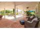 Inviting covered patio with comfortable seating and dining options, perfect for relaxing and enjoying the outdoors at 36408 E Eldorado Lake Dr, Eustis, FL 32736