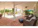 Relaxing covered patio features comfortable seating and a dining area, brick pavers at 36408 E Eldorado Lake Dr, Eustis, FL 32736
