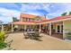 Expansive patio with an outdoor dining area and comfortable seating arrangements at 36408 E Eldorado Lake Dr, Eustis, FL 32736