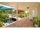 Charming covered patio featuring a bridge over a koi pond, and brick pavers at 36408 E Eldorado Lake Dr, Eustis, FL 32736
