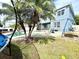 Backyard featuring a pool, patio, and lush green lawn for outdoor enjoyment at 405 Bella Vida Blvd, Orlando, FL 32828