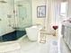 Bathroom featuring a soaking tub with glass shower and modern fixtures at 405 Bella Vida Blvd, Orlando, FL 32828