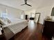Primary bedroom with wood floors and a ceiling fan at 405 Bella Vida Blvd, Orlando, FL 32828