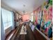 Bright dining area with unique wall decor, chandelier, and an open view to the kitchen at 405 Bella Vida Blvd, Orlando, FL 32828