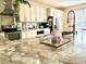 Bright kitchen with a granite island, stainless steel appliances, and ample counter space at 405 Bella Vida Blvd, Orlando, FL 32828