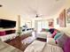 Bright living room with hardwood floors, comfortable seating, and an open floor plan at 405 Bella Vida Blvd, Orlando, FL 32828