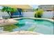 Backyard pool with lounge area, palm tree, and privacy fence at 405 Bella Vida Blvd, Orlando, FL 32828