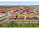 Aerial view showcases a community with tile roofs and screened-in pools, providing a serene and private backyard retreat at 411 Cabello Dr, Davenport, FL 33837
