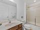Bathroom featuring a vanity, toilet, and shower with glass doors at 411 Cabello Dr, Davenport, FL 33837