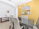 Open dining area featuring a glass table, chandelier, connecting to another room at 411 Cabello Dr, Davenport, FL 33837
