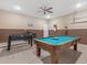 Game room features a foosball table, pool table, ceiling fan and other amenities for entertainment at 411 Cabello Dr, Davenport, FL 33837