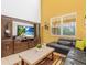 Comfortable living room with entertainment center and leather sofa at 411 Cabello Dr, Davenport, FL 33837