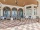 A comfortable outdoor patio space featuring stylish seating and an inviting atmosphere in neutral tones at 411 Cabello Dr, Davenport, FL 33837